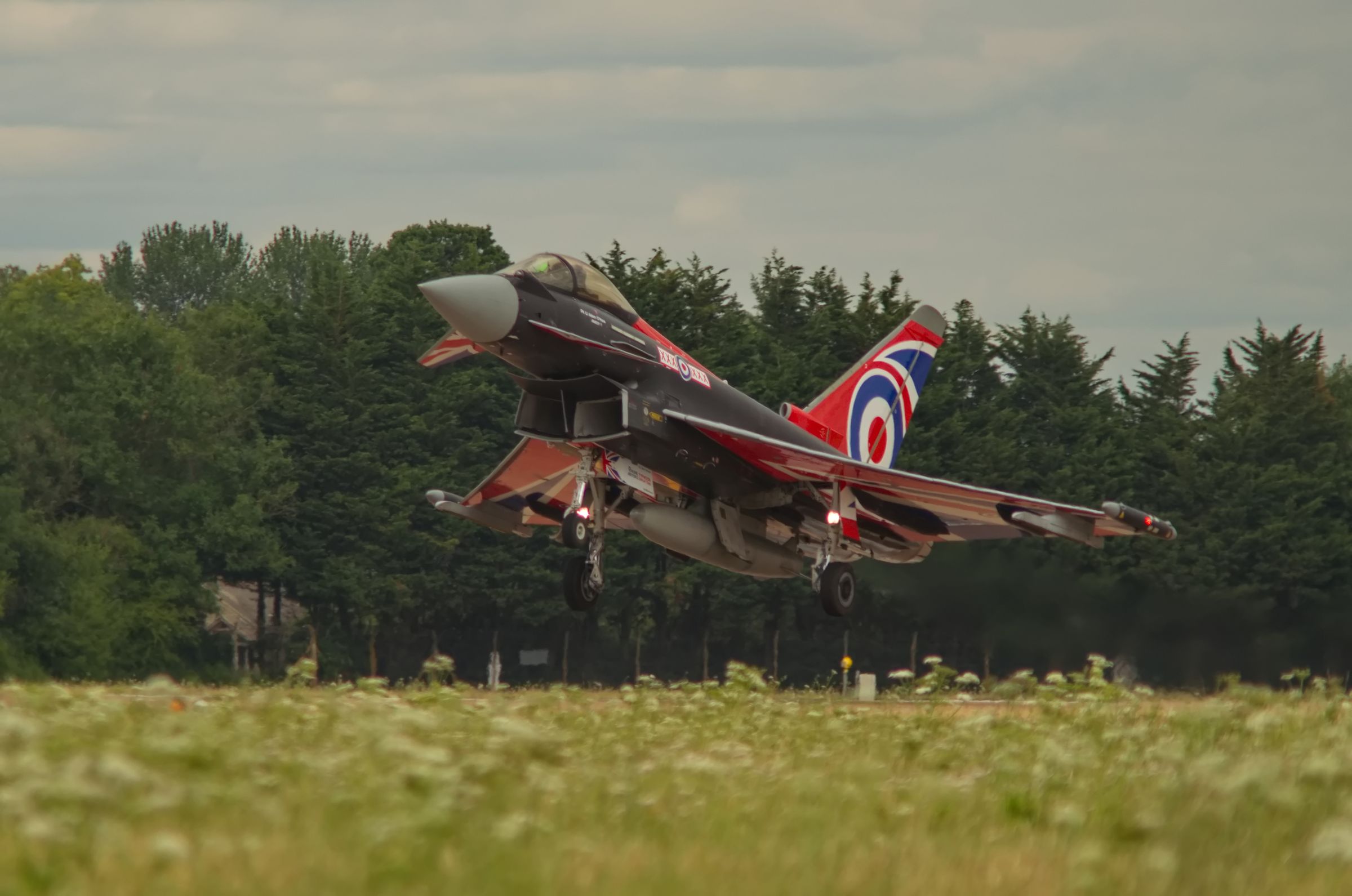 An RAF Typhoon in the 2022 Typhoon Display Team livery landing at RAF Fairford during RIAT 2022.