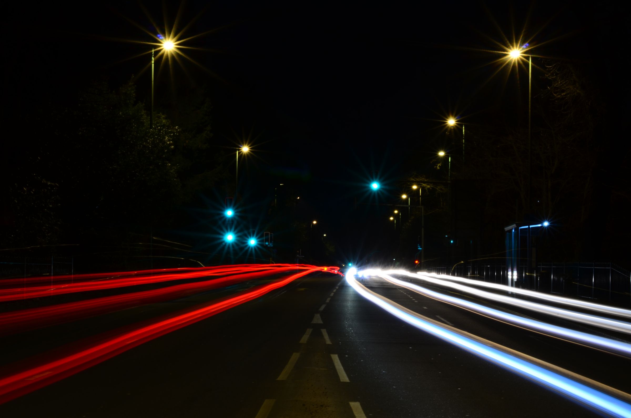 A blur of car lights on a road at night.