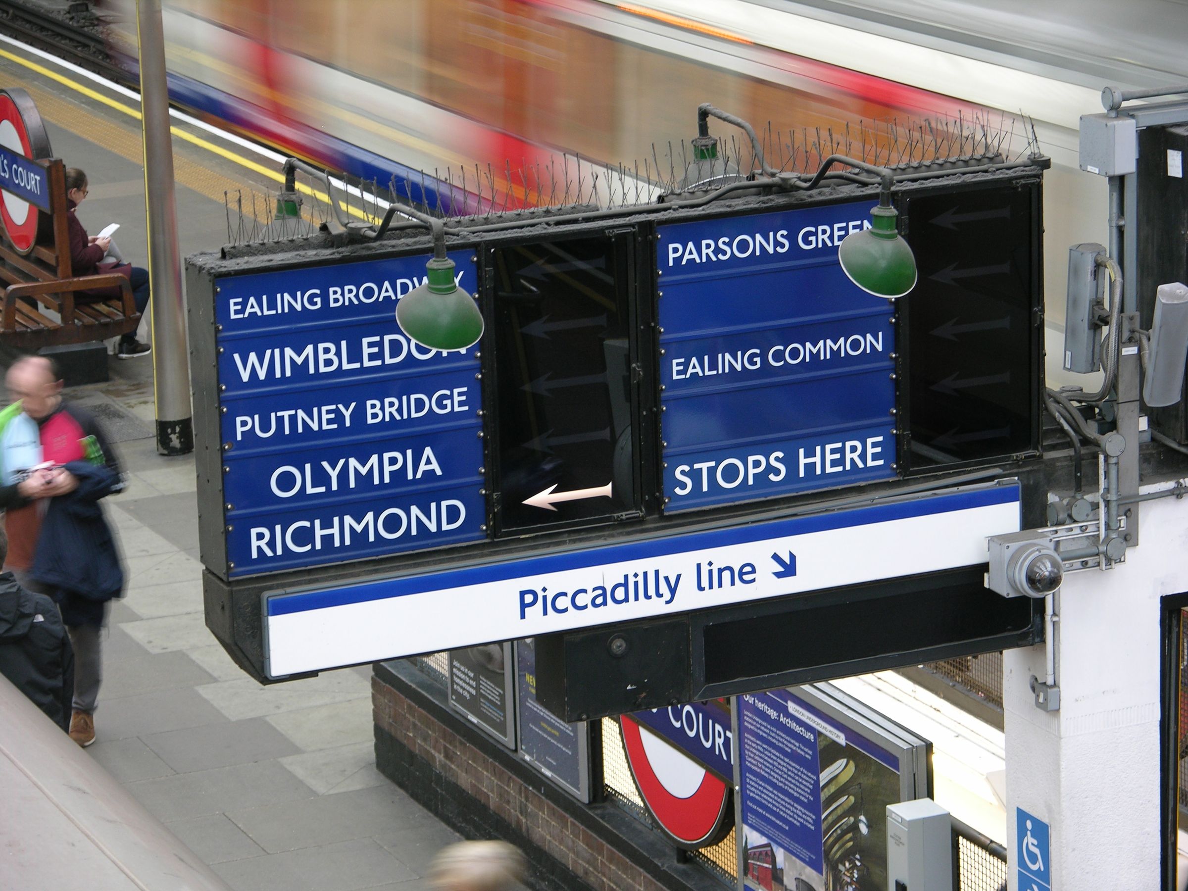 A sign showing the destination of the next tube train at Earl's Court station in London, UK.